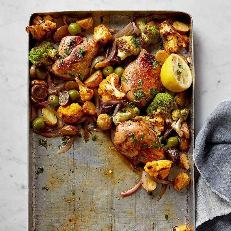 TRAY BAKE: GARLIC-THYME CHICKEN WITH CAULIFLOWER, POTATOES & OLIVES