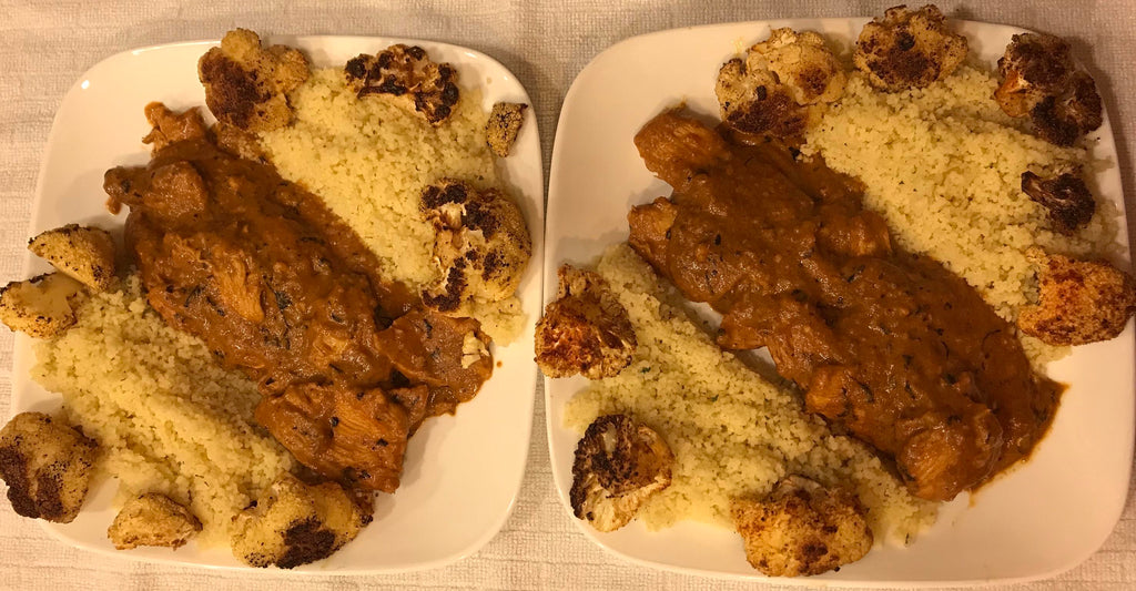 Butter chicken curry with garlic and herb couscous along side oven roasted cauliflower.